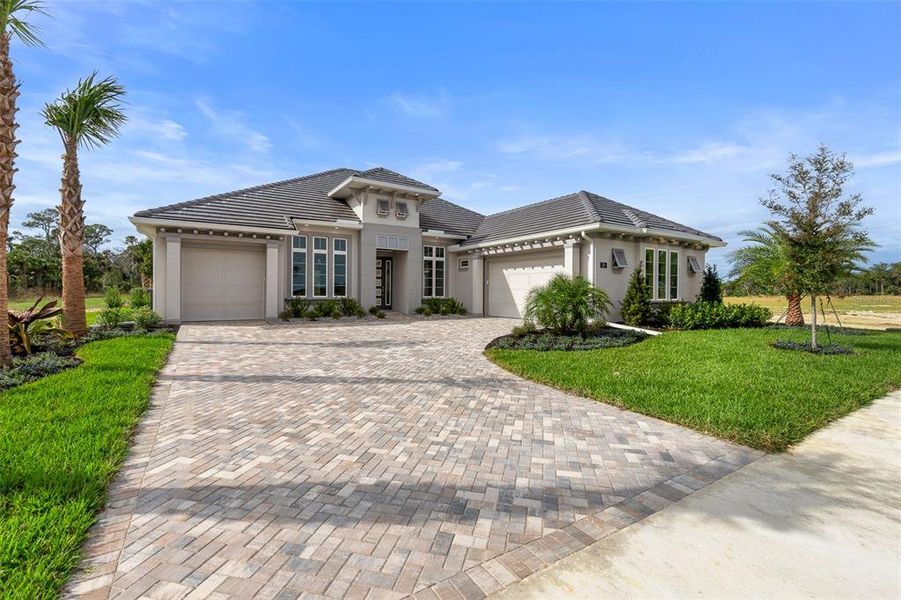 Front exterior of a new home in Veranda Bay, Flagler Beach, FL, highlighting curb appeal (Image 22). Front exterior of a new home in Veranda Bay, Flagler Beach, FL, highlighting curb appeal (Image 22).
