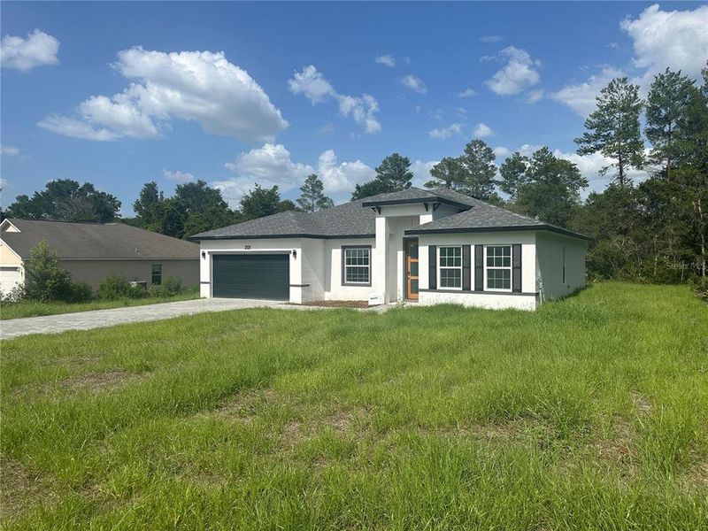 Front exterior of a new home in , Ocala, FL, highlighting curb appeal (Image 20).