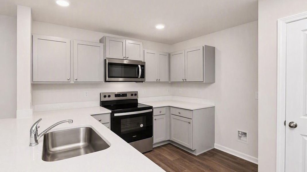 Furnished interior view inside a new home in Hunter's Branch Townhomes, Hopkins (Image 5). Furnished interior view inside a new home in Hunter's Branch Townhomes, Hopkins (Image 5).