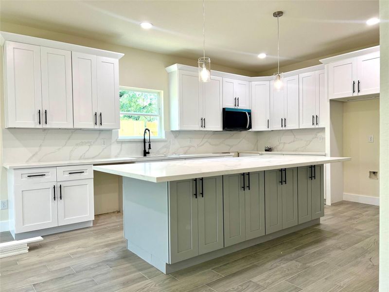 Spacious open-concept kitchen and dining area, perfect for entertaining. Spacious open-concept kitchen and dining area, perfect for entertaining.