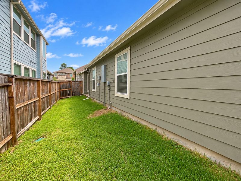 Exterior details and patio area of a home in Woodforest, Montgomery (Image 22).