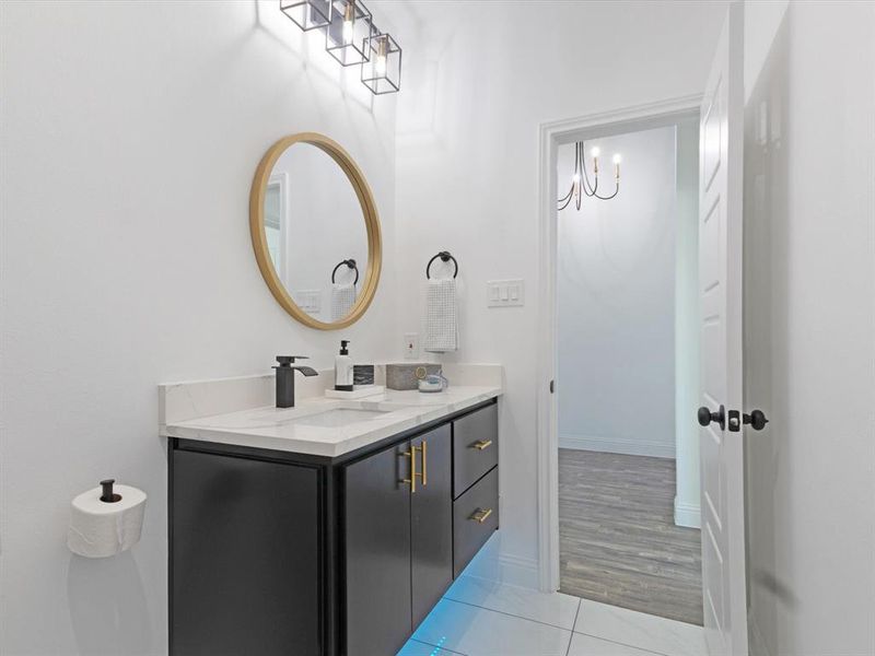 Bathroom featuring vanity and hardwood / wood-style floors