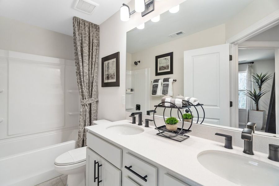 Representative furnished interior of a home built from the Greystone by Taylor Morrison in Silverstone Townes, Knightdale (Image 13).