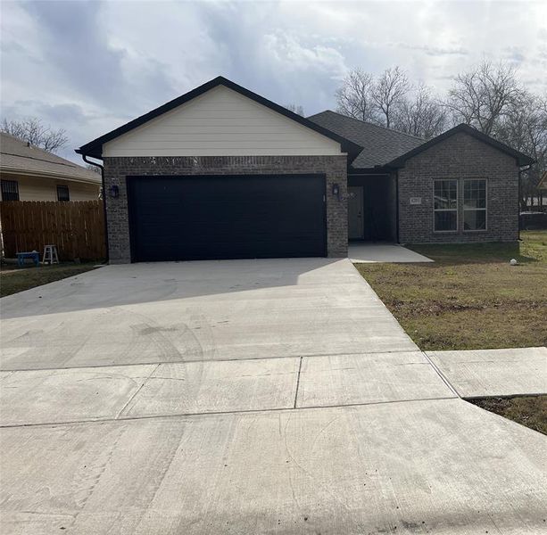 Front exterior of a new home in , Greenville, TX, highlighting curb appeal (Image 17).