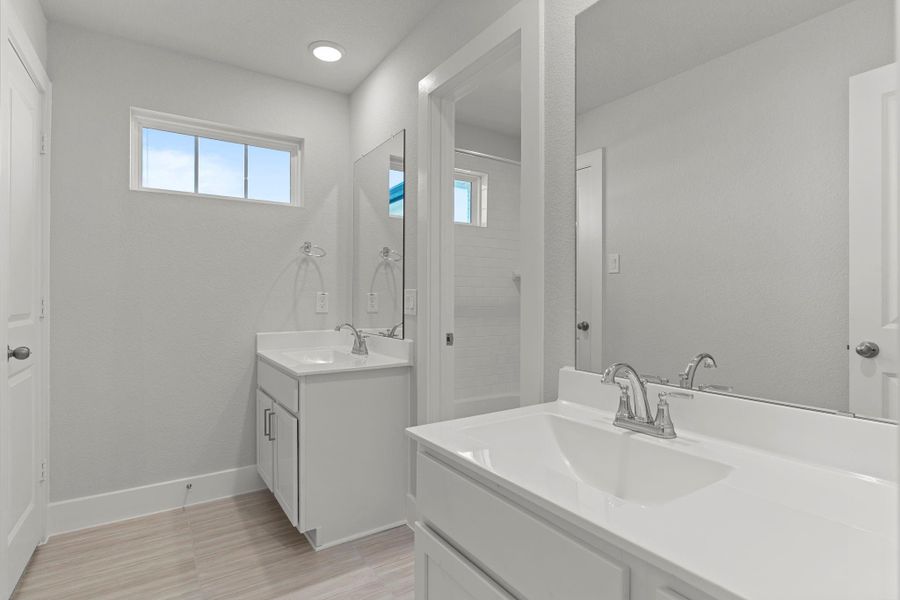 The upstairs full bath offers clean lines, a bright atmosphere, and a modern vanity with ample counter space. Its thoughtful design provides comfort and convenience for family or guests.