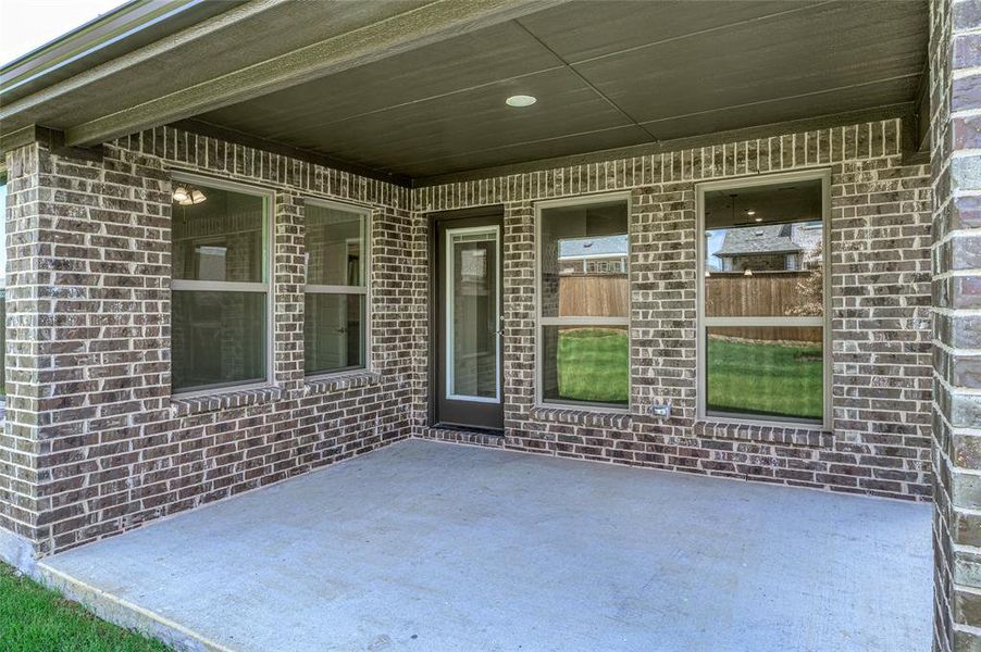 Exterior details and patio area of a home in Creekview Meadows, Pilot Point (Image 3).
