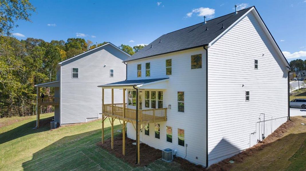 Front exterior of a new home in Water Oak Estates, Lawrenceville, GA, highlighting curb appeal (Image 1).