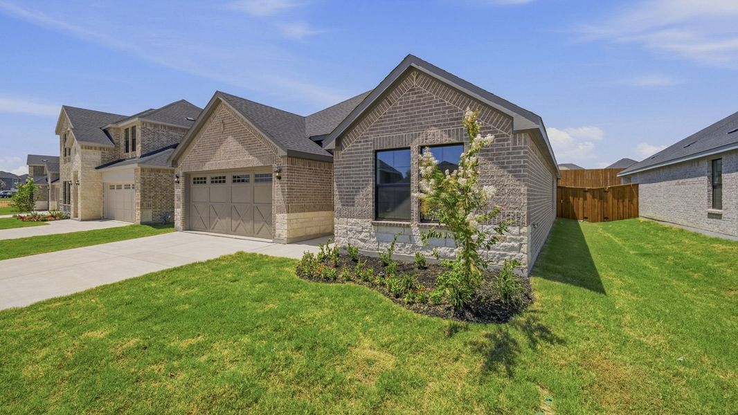 Front exterior of a new home in Windchime, Celina, TX, highlighting curb appeal (Image 2). Front exterior of a new home in Windchime, Celina, TX, highlighting curb appeal (Image 2).