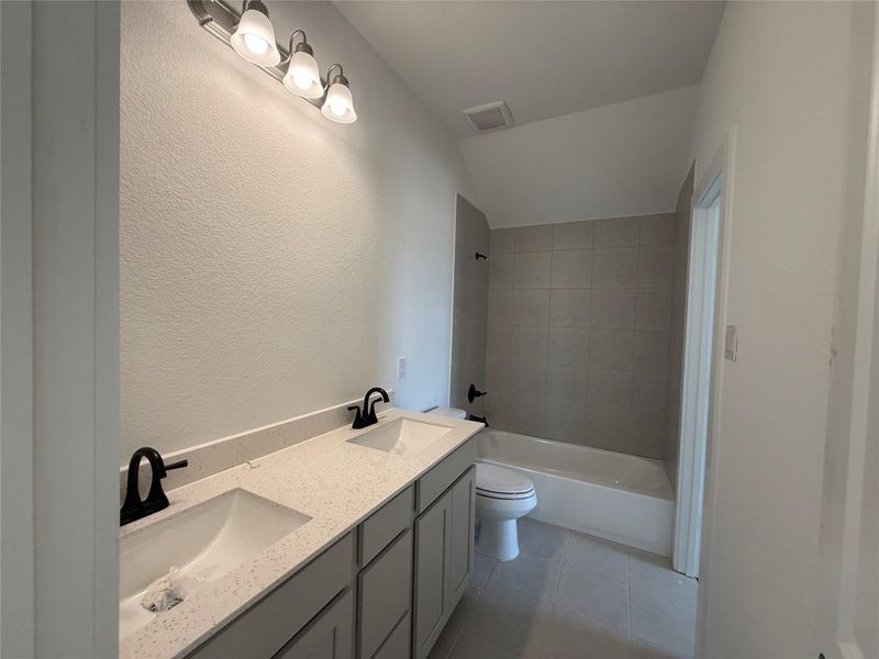 This bathroom has plenty of cabinet space for everyone and has two vanities to accommodate everyone. This bathroom has plenty of cabinet space for everyone and has two vanities to accommodate everyone.