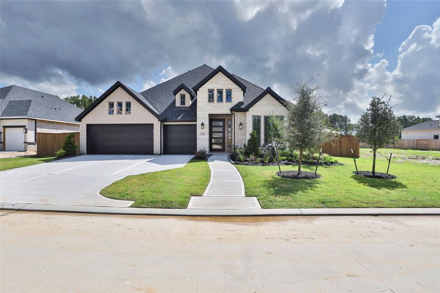 Front exterior of a new home in The Highlands, Porter, TX, highlighting curb appeal (Image 2).