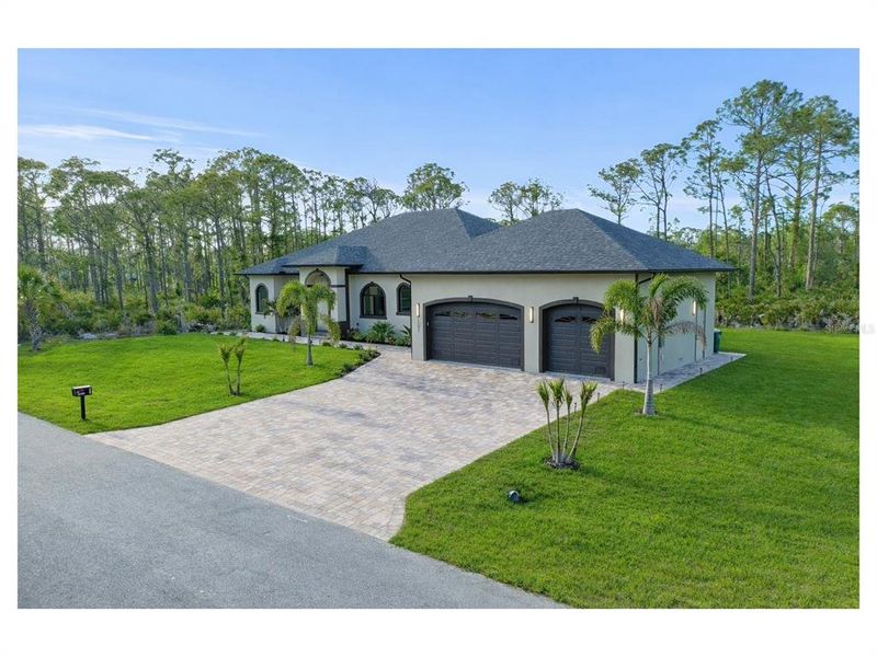 Front exterior of a new home in , Port Charlotte, FL, highlighting curb appeal (Image 28).