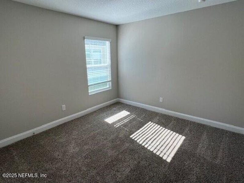 Spacious, unfurnished interior of a new home in Sawmill Branch, Palm Coast (Image 22).