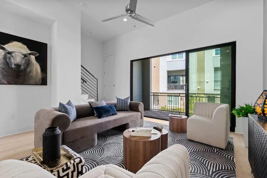 Massive sliding glass doors open from the living area directly onto a private balcony. Massive sliding glass doors open from the living area directly onto a private balcony.