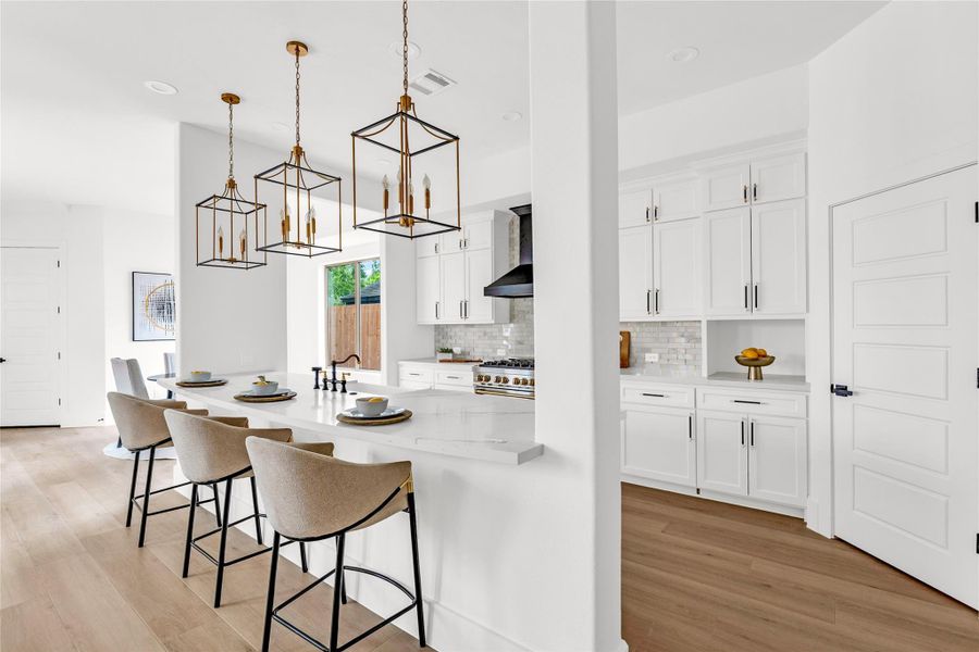 The open kitchen flows directly into the breakfast room. The open kitchen flows directly into the breakfast room.