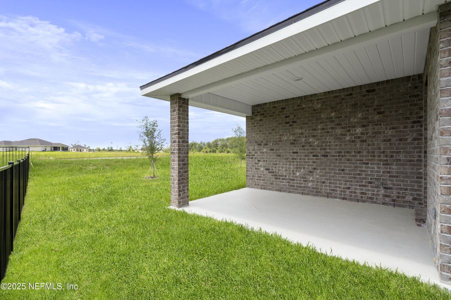 Exterior details and patio area of a home in Shadow Crest at Rolling Hills, Green Cove Springs (Image 18). Exterior details and patio area of a home in Shadow Crest at Rolling Hills, Green Cove Springs (Image 18).
