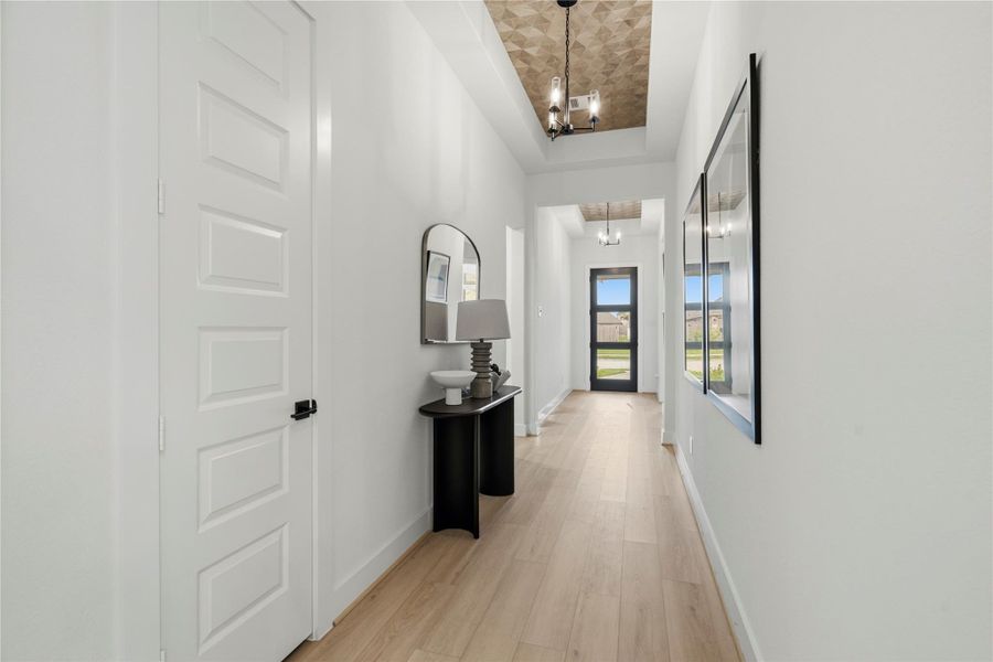 Long welcoming entry way with beautiful hardwood floors Long welcoming entry way with beautiful hardwood floors