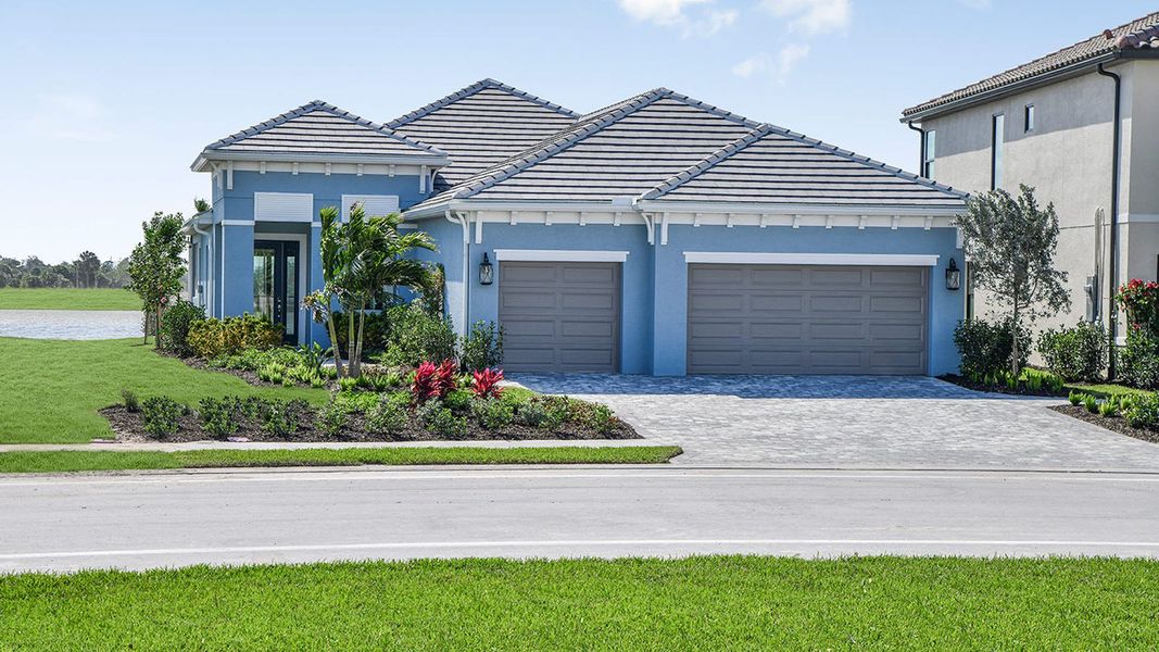Front exterior of a new home in SkySail Real Estate and Homes for Sale in Naples, FL - Neal Communities, Naples, FL, highlighting curb appeal (Image 1). Front exterior of a new home in SkySail Real Estate and Homes for Sale in Naples, FL - Neal Communities, Naples, FL, highlighting curb appeal (Image 1).
