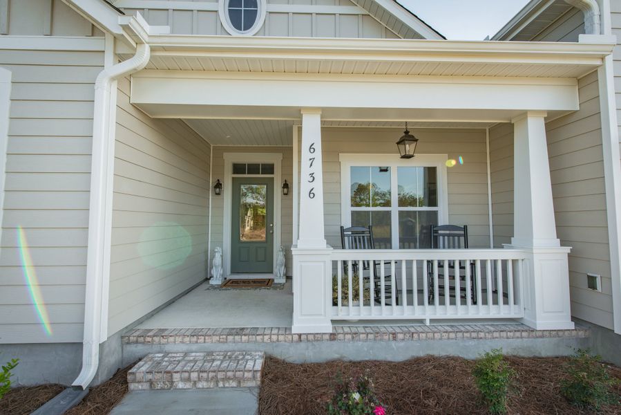Representative exterior details of a home built from the Helmsley by Bill Clark Homes in The Sanctuary at Sunset Beach, Sunset Beach (Image 3). Representative exterior details of a home built from the Helmsley by Bill Clark Homes in The Sanctuary at Sunset Beach, Sunset Beach (Image 3).