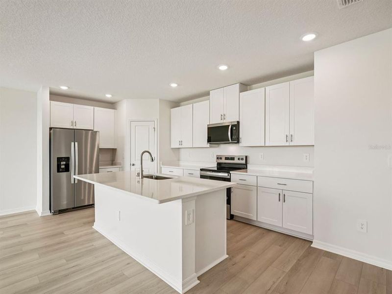 Furnished interior view inside a new home in Oakfield Trails - Classic Series, Parrish (Image 2). Furnished interior view inside a new home in Oakfield Trails - Classic Series, Parrish (Image 2).