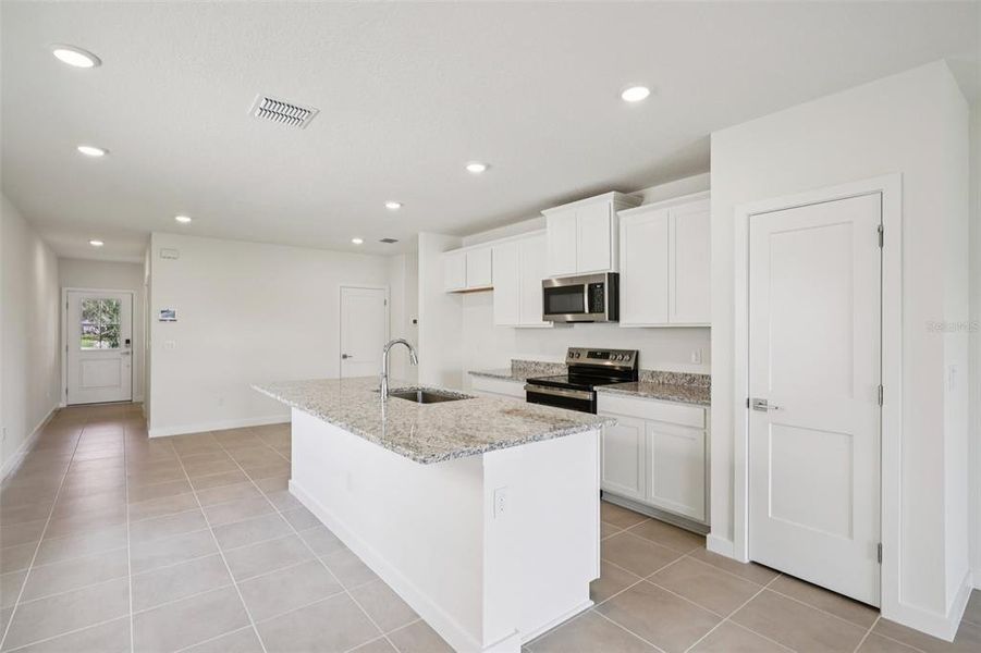Furnished interior view inside a new home in Grasslands West, Lakeland (Image 9).