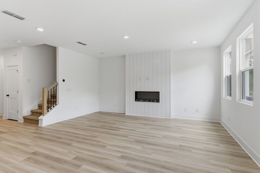 A large empty living room. A large empty living room.
