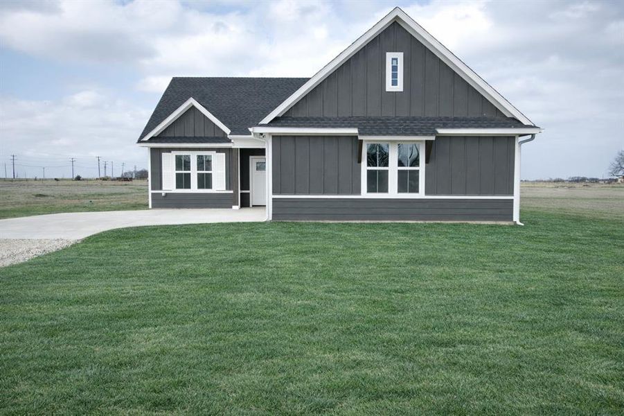 Front exterior of a new home in , Sadler, TX, highlighting curb appeal (Image 24).