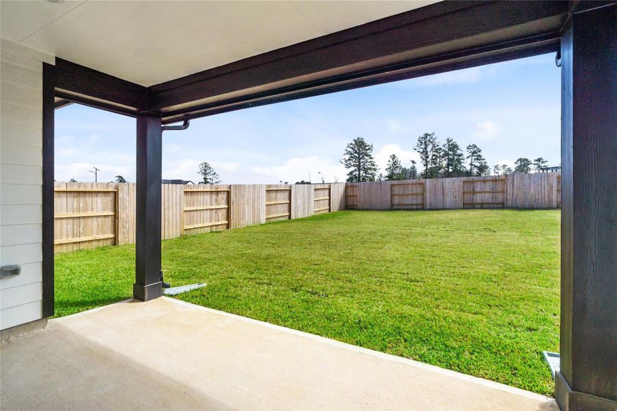 The spacious covered patio offers a tranquil outdoor retreat, perfectly designed for savoring your quiet morning coffee or unwinding during peaceful evening relaxation.
