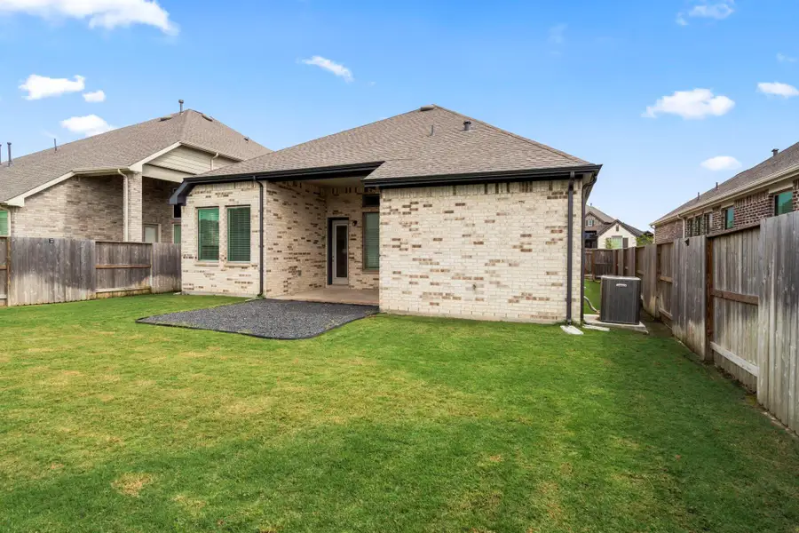 Exterior details and patio area of a home in Meridiana, Iowa Colony (Image 2).