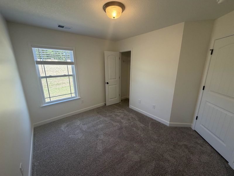 Spacious, unfurnished interior of a new home in Stones Throw, Inman (Image 11).