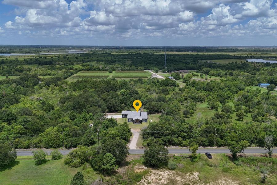 Overhead view of the front of the home. Property backs up to an orchard and Galveston Bay! Overhead view of the front of the home. Property backs up to an orchard and Galveston Bay!