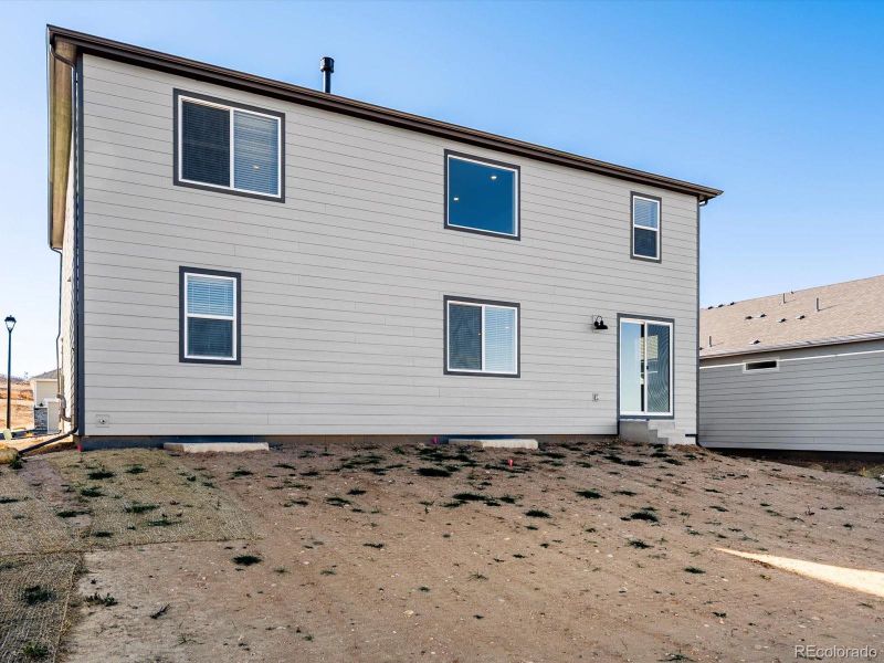 Exterior details and patio area of a home in Poudre Heights: The Alpine Collection, Windsor (Image 2). Exterior details and patio area of a home in Poudre Heights: The Alpine Collection, Windsor (Image 2).
