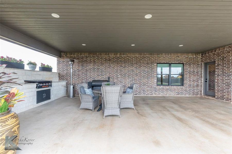 View of patio / terrace with outdoor dining area and area for grilling View of patio / terrace with outdoor dining area and area for grilling