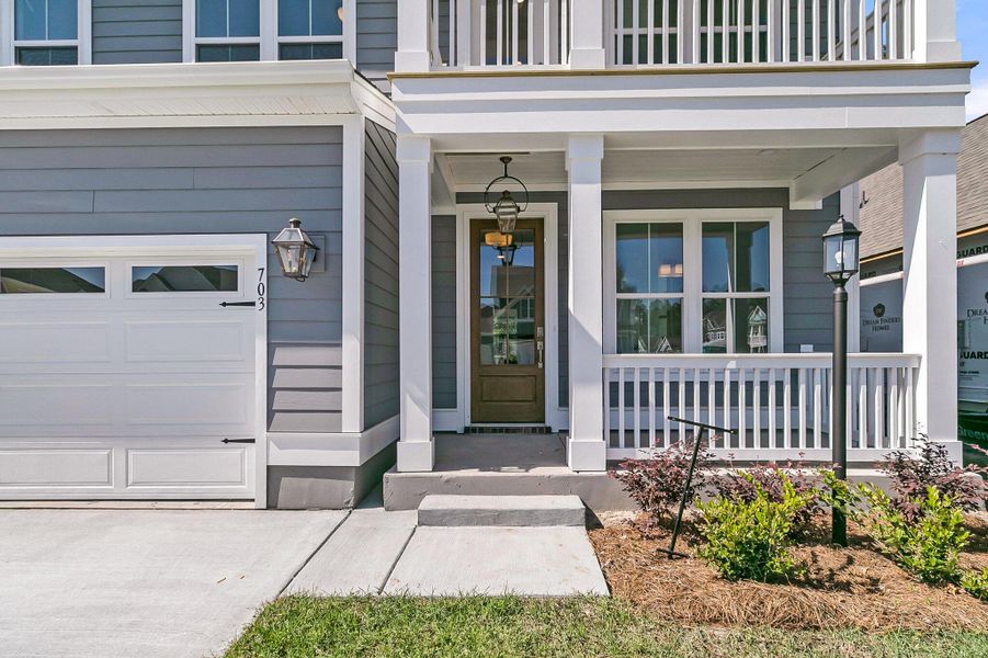 Front exterior of a new home in Tidewater at Lakes of Cane Bay, Summerville, SC, highlighting curb appeal (Image 18). Front exterior of a new home in Tidewater at Lakes of Cane Bay, Summerville, SC, highlighting curb appeal (Image 18).