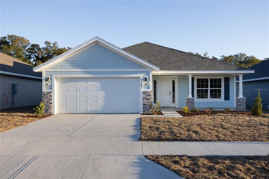Front exterior of a new home in Kirkland Farms, Alachua, FL, highlighting curb appeal (Image 1). Front exterior of a new home in Kirkland Farms, Alachua, FL, highlighting curb appeal (Image 1).