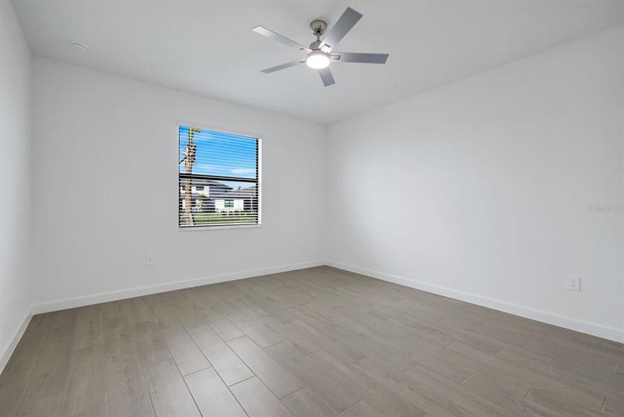 Spacious, unfurnished interior of a new home in Verdana Village, Estero (Image 17).