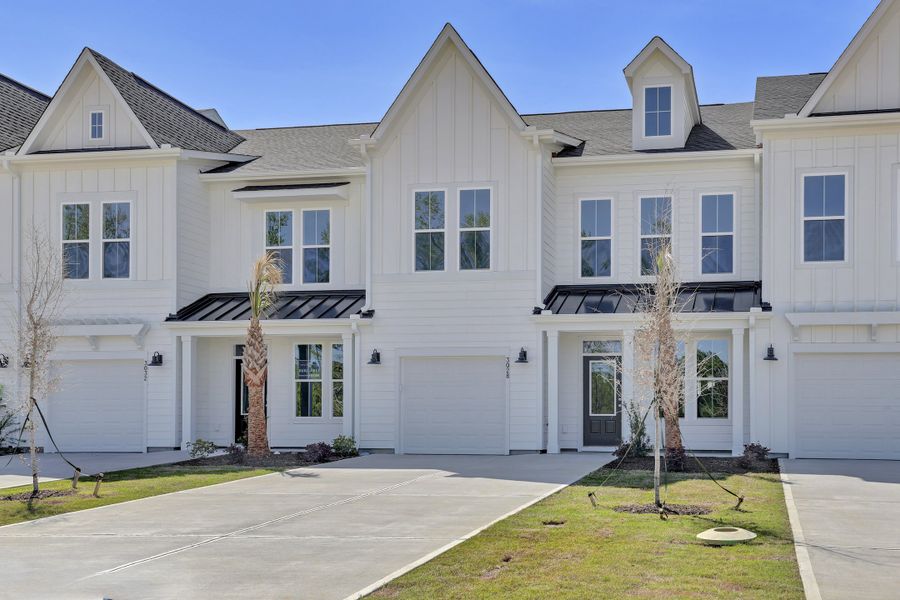 Front exterior of a new home in Grand Park, Leland, NC, highlighting curb appeal (Image 1). Front exterior of a new home in Grand Park, Leland, NC, highlighting curb appeal (Image 1).
