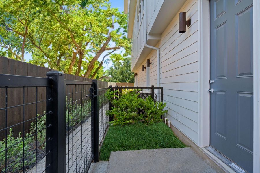 Front exterior of a new home in Bluebonnet Lofts, Austin, TX, highlighting curb appeal (Image 2). Front exterior of a new home in Bluebonnet Lofts, Austin, TX, highlighting curb appeal (Image 2).