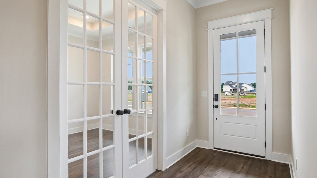 Interior front entry with access to study area with French doors Interior front entry with access to study area with French doors