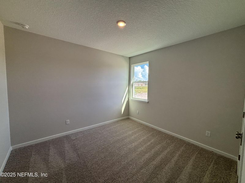 Spacious, unfurnished interior of a new home in The Magnolia Series at Reserve East, Flagler Beach (Image 12).