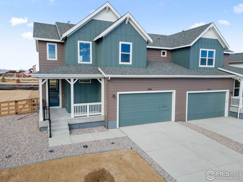 Front exterior of a new home in Cordovan, Longmont, CO, highlighting curb appeal (Image 2). Front exterior of a new home in Cordovan, Longmont, CO, highlighting curb appeal (Image 2).