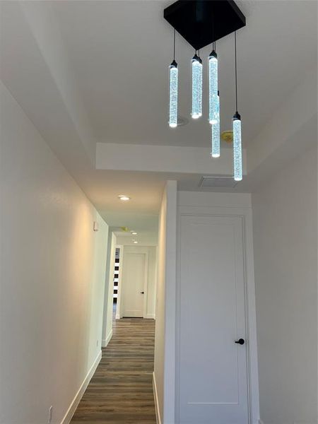 Hall featuring recessed lighting and dark wood-type flooring