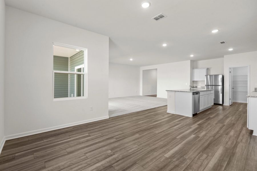Representative unfurnished interior of a home built from the Europa by Starlight Homes in Oakfield Lakes, Parrish (Image 12).