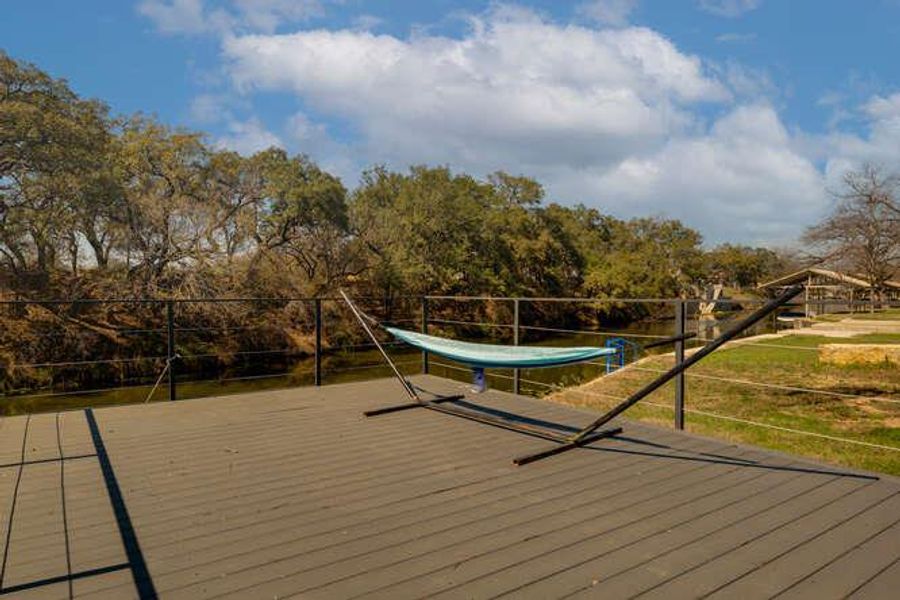 Deck featuring view of scattered trees