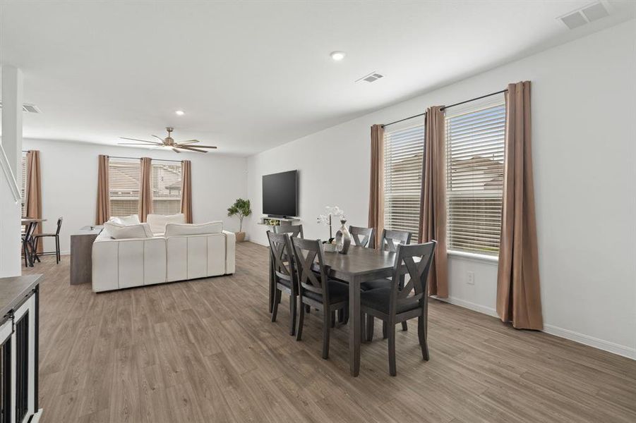 Dedicated Dining Room offers direct access to the Gourmet Kitchen, fabulous flooring, and oversized windows which fills the space with natural lighting.