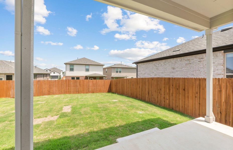 Exterior details and patio area of a home in Saddleback at Santa Rita Ranch, Liberty Hill (Image 16).