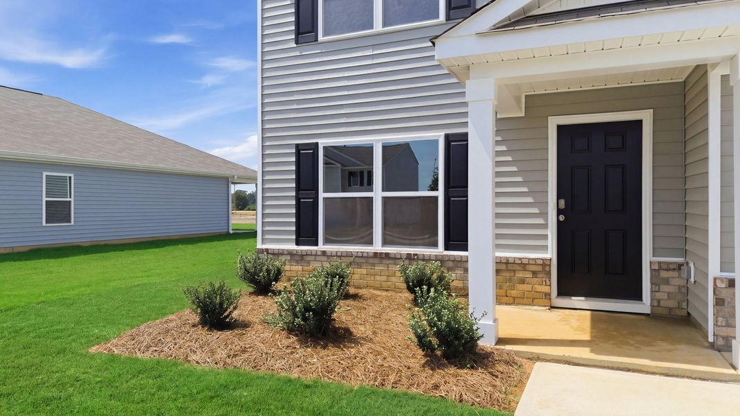 Exterior details and patio area of a home in Bynum Farms, Farmville (Image 3). Exterior details and patio area of a home in Bynum Farms, Farmville (Image 3).