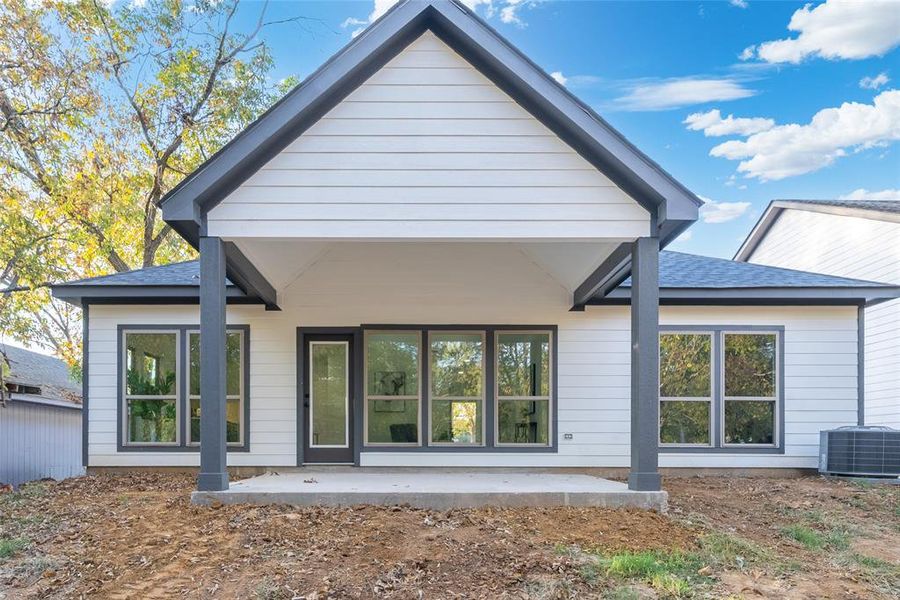 Back of property with a patio and central AC unit