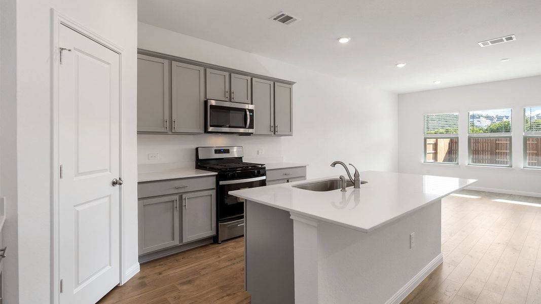 Furnished interior view inside a new home in Bar W Ranch, Leander (Image 5).