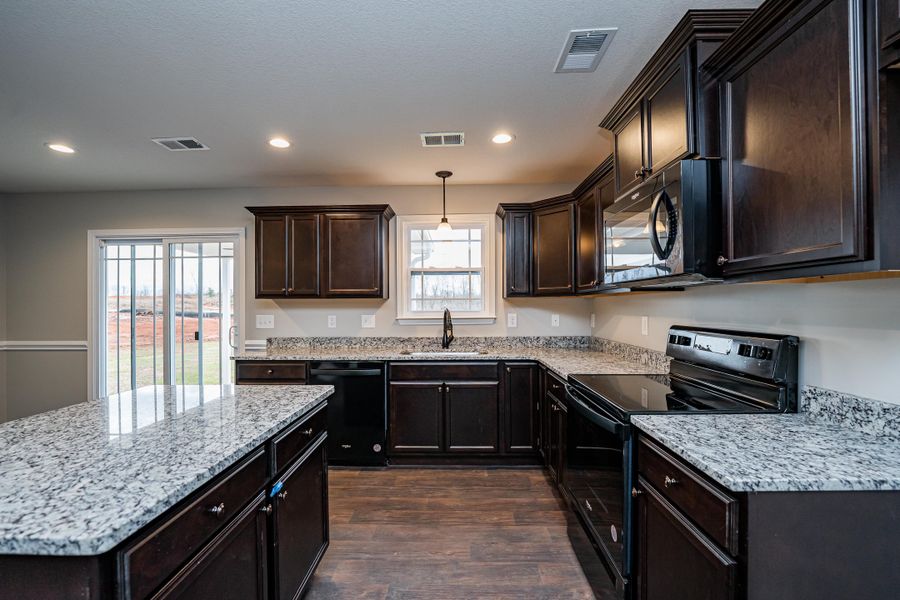 Representative furnished interior of a home built from the Saxon by Enchanted Homes in Huckleberry Cove, Chesnee (Image 10). Representative furnished interior of a home built from the Saxon by Enchanted Homes in Huckleberry Cove, Chesnee (Image 10).