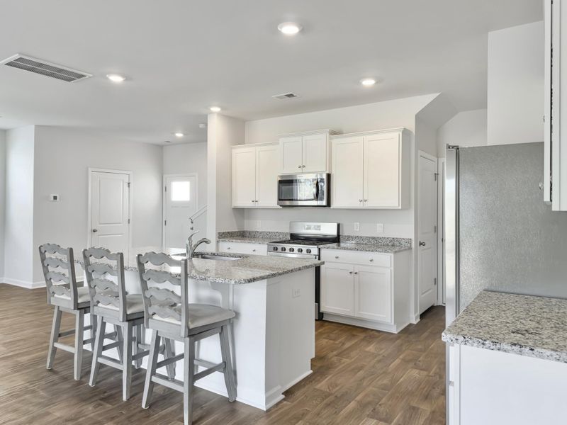 Furnished interior view inside a new home in Pine Hills at Cane Bay, Summerville (Image 12). Furnished interior view inside a new home in Pine Hills at Cane Bay, Summerville (Image 12).
